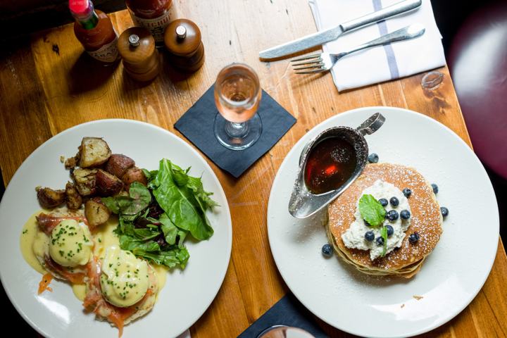 Brunch table eggs benedict pancakes