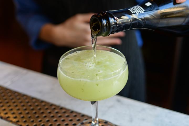 Topping a cocktail with sparkling wine