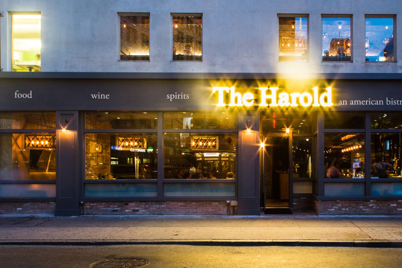 The Harold on Broadway at 32nd Street, lit up at night